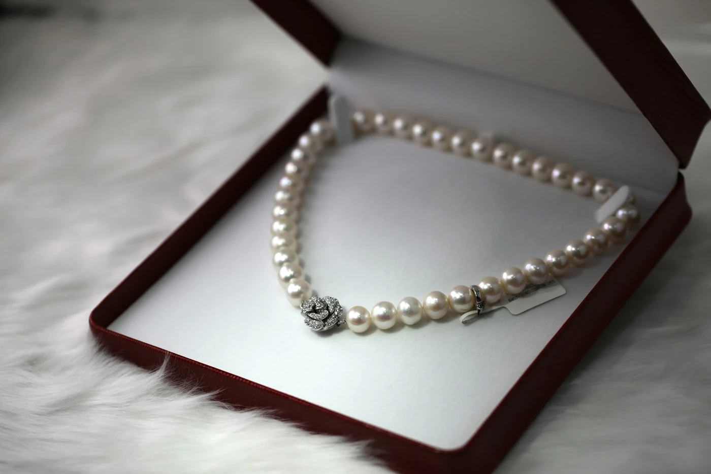 Pearl necklace laid in a presentation box