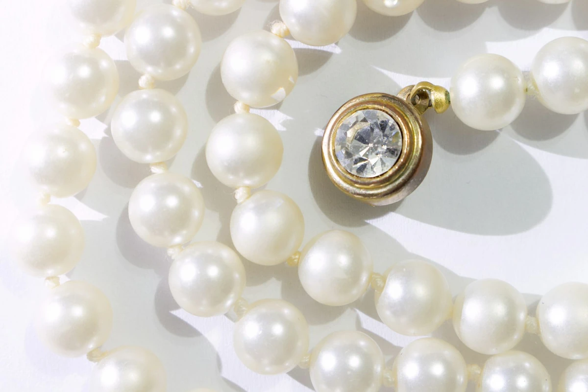 Pearl strand with a gold clasp