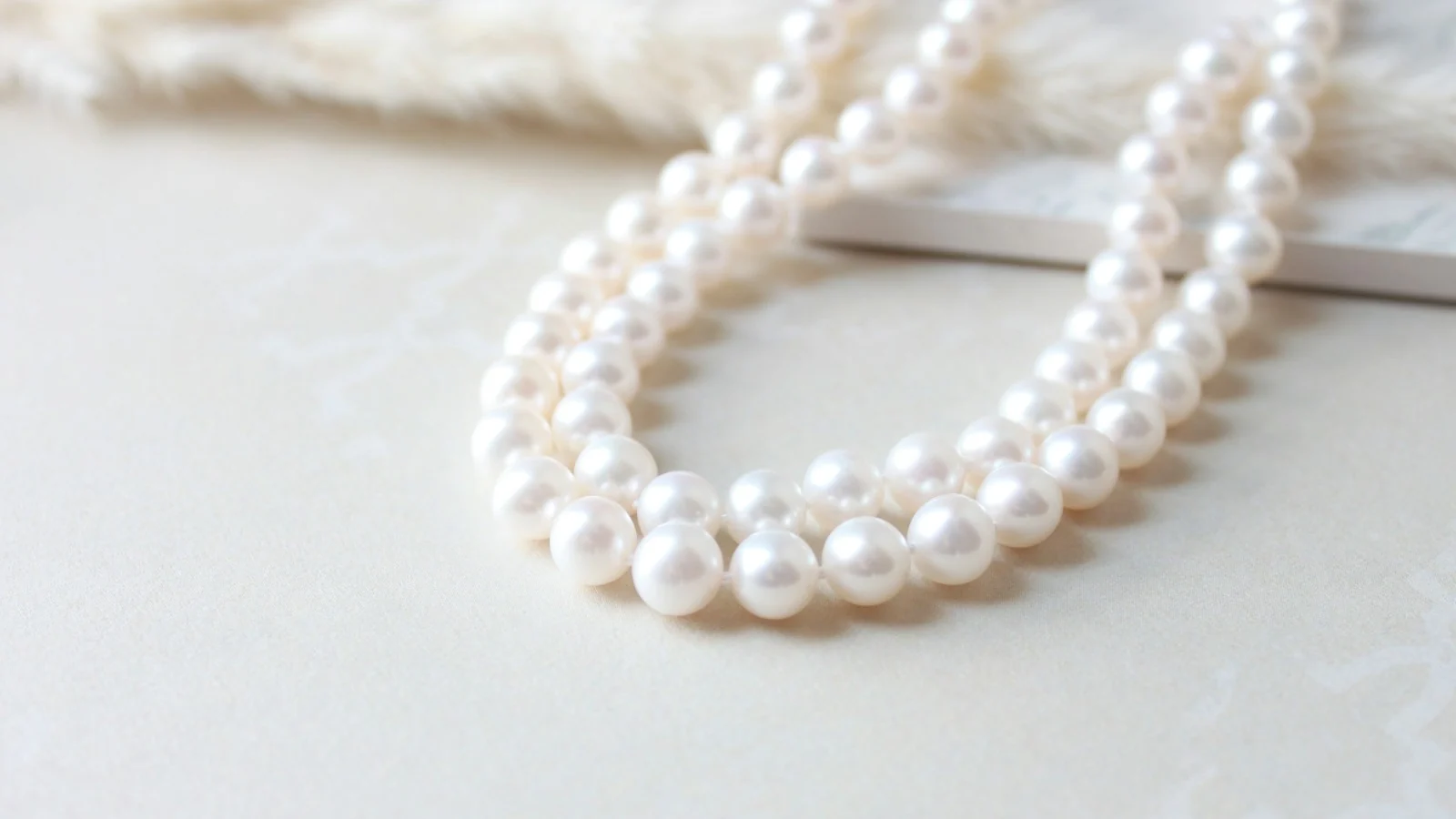 Close-up of a round white pearl necklace