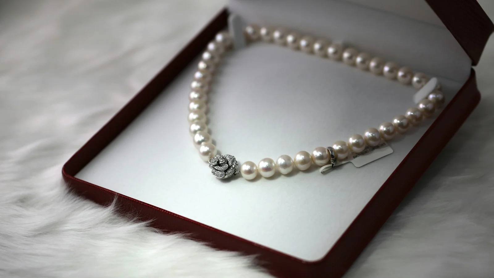 White pearl strand necklace in an open presentation box