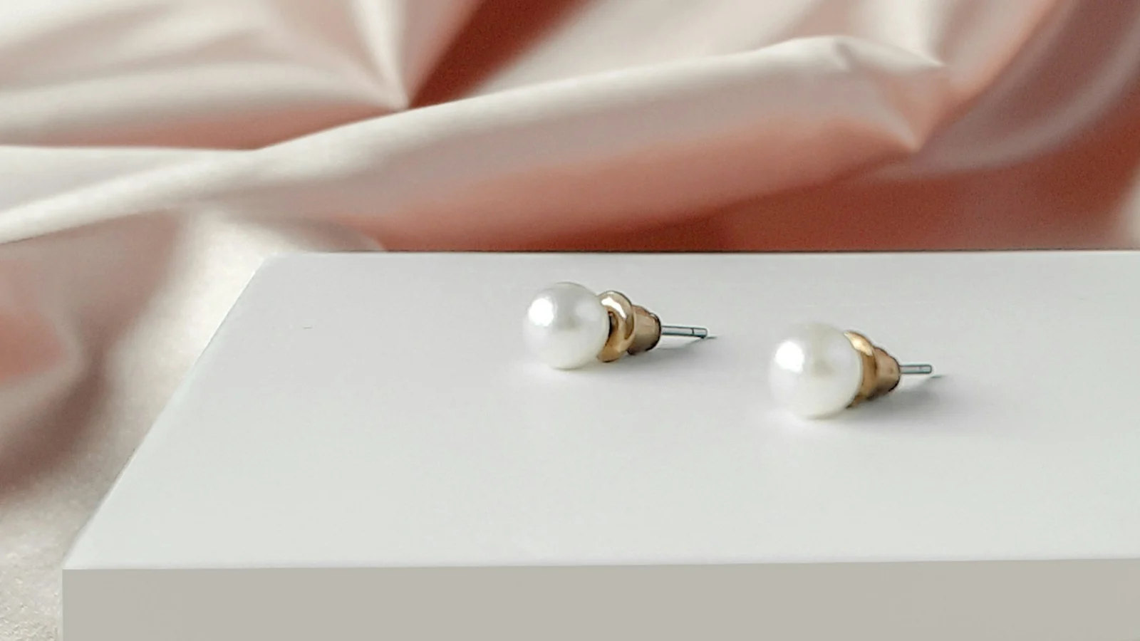 Matched pair of white pearl stud earrings