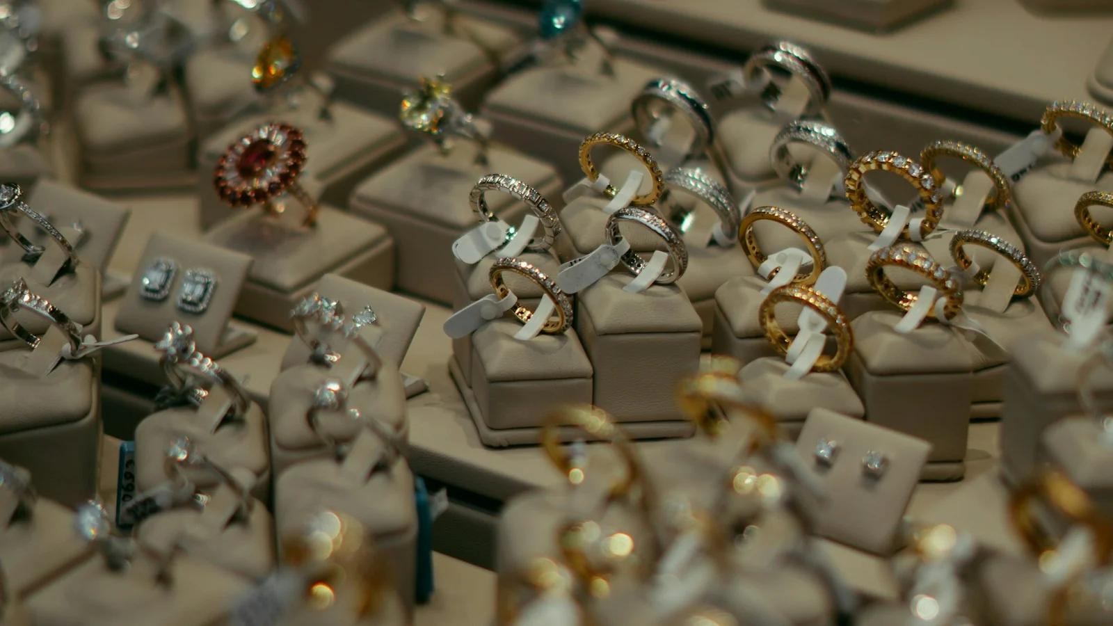 Trays of rings and jewelry displayed in bulk