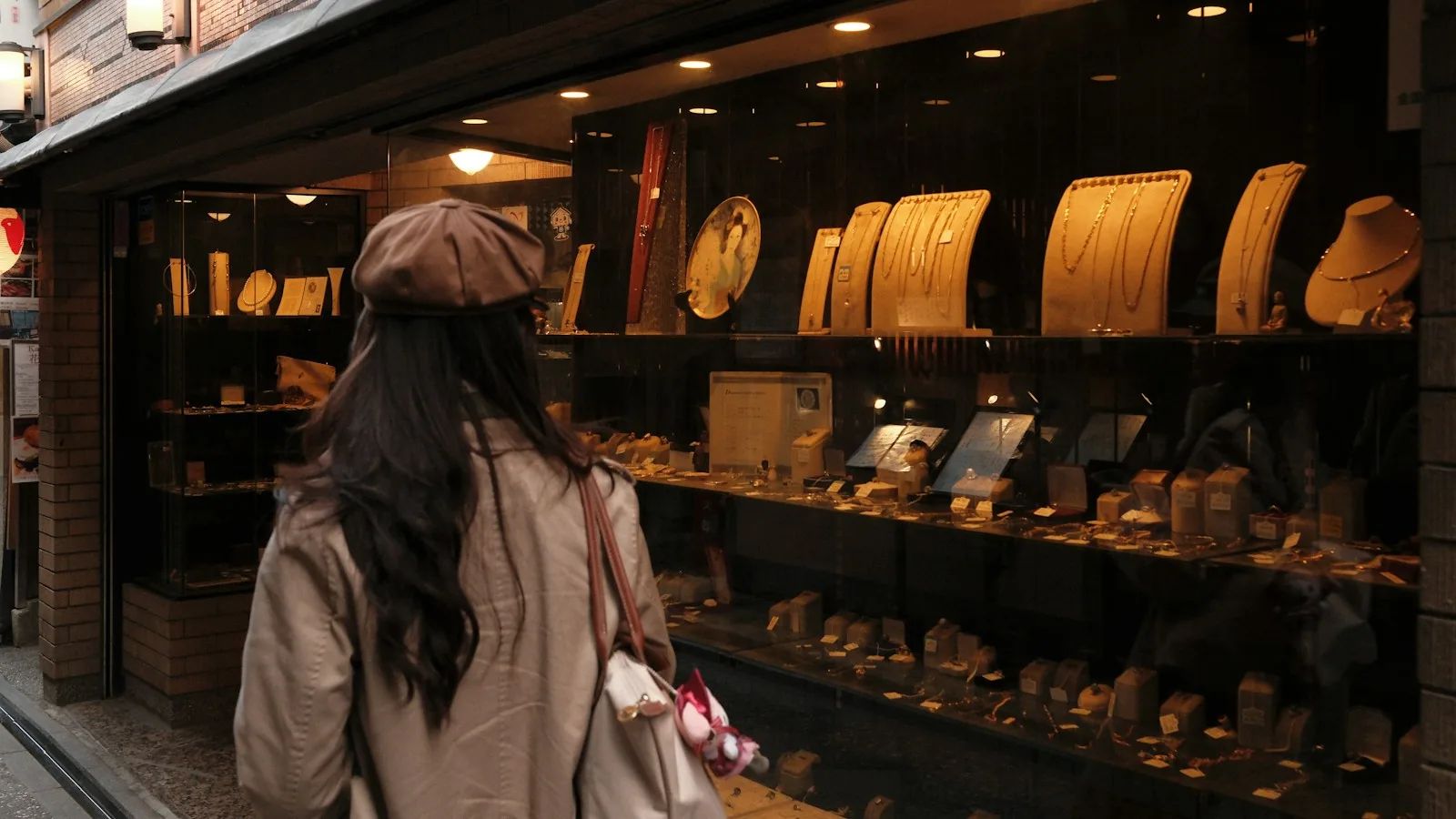 Shopper looking into a jewelry shop window