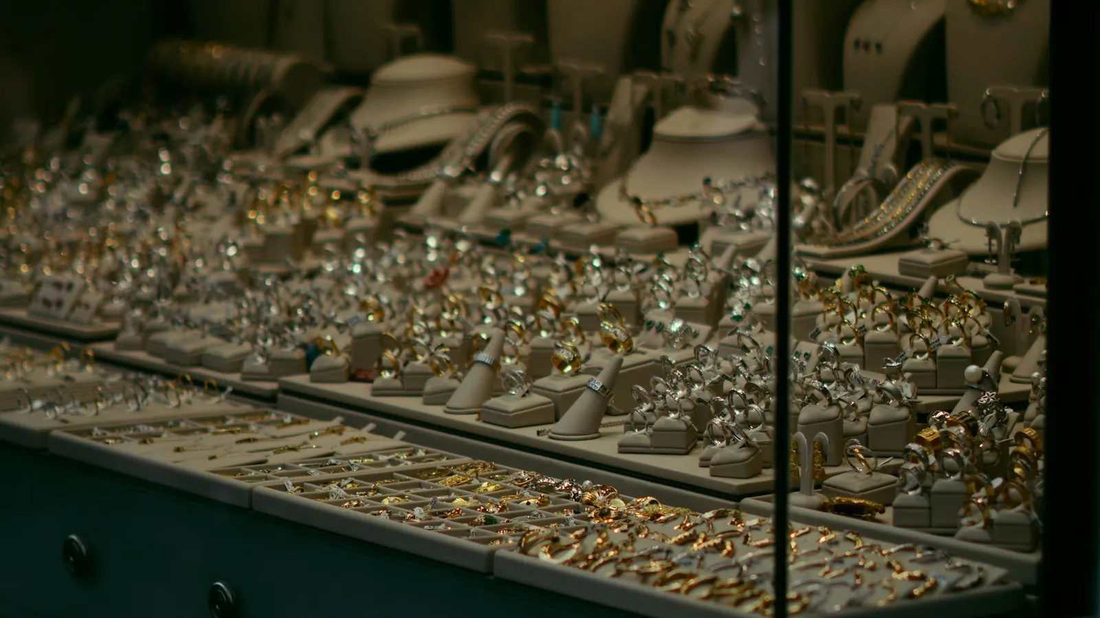Display case filled with gold and silver jewelry