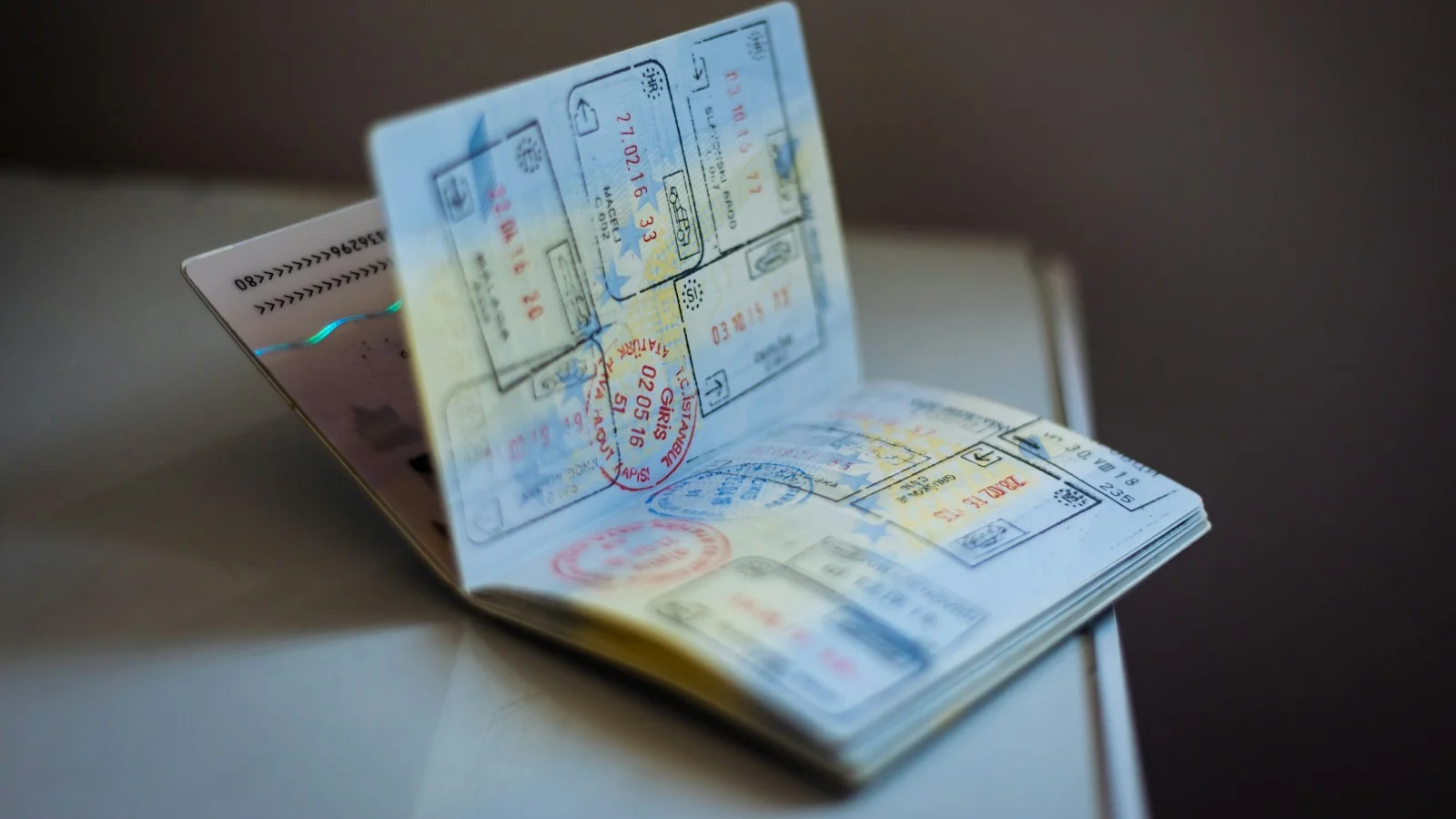 Open passport with entry and exit stamps